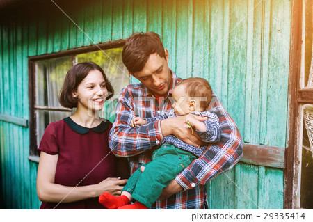 图库照片: young family with a child on the nature