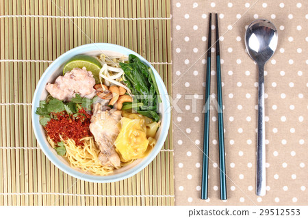 图库照片: boiled noodle and wonton in spicy sour soup.