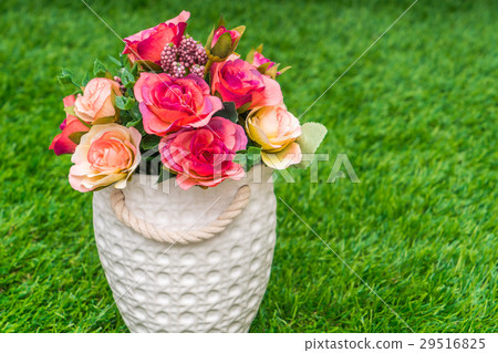 图库照片: beautiful of artificial flowers on grass