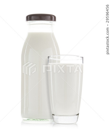 图库照片 a cup of milk and bottle of milk isolated