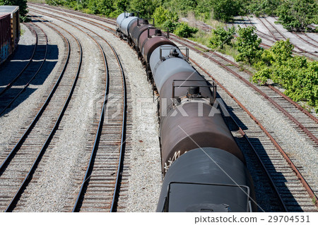 图库照片: old chemichal tanks train wagons on rail tracks