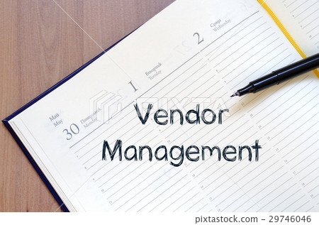 图库照片: vendor management write on notebook