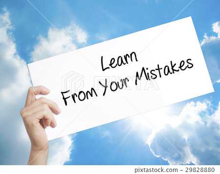 图库照片: hand holding text learn from your mistakes