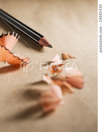 图库照片: close up sharpen black pencil on brown paper