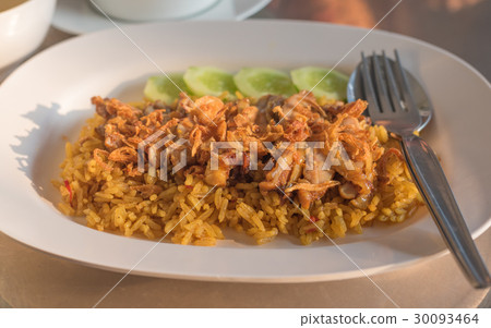 图库照片: chicken biryani with green chutney in dish