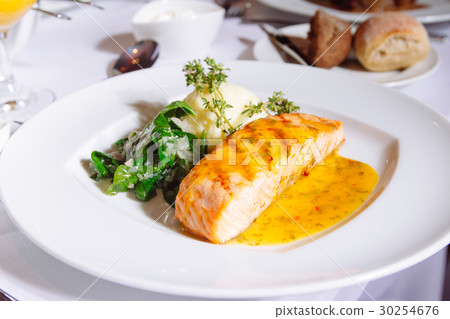 图库照片: grilled salmon steak with spinach,mash potato