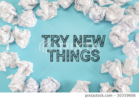 图库照片 try new things text with crumpled paper balls