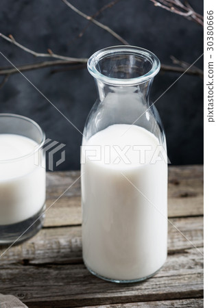 图库照片: close-up of a glass of milk and an open glass milk