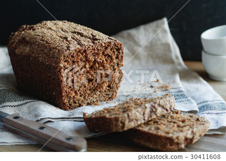 图库照片: close-up of loaf of whole grain rye bread on a