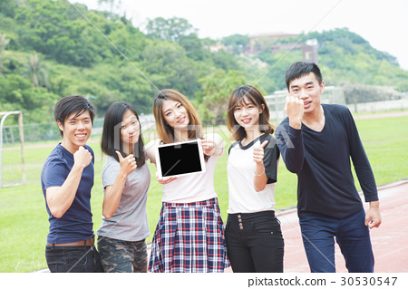 图库照片: group of happy teen high school students outdoors