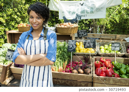 图库照片: woman selling fresh local vegetable from farm at