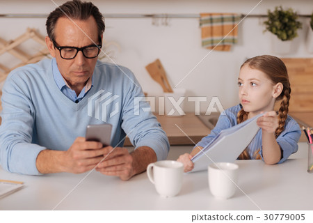 图库照片: indifferent businessman ignoring little kid at