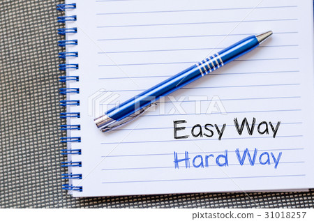 图库照片: easy way hard way write on notebook