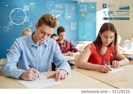 students,figures 图库照片: group of students with books writing school test