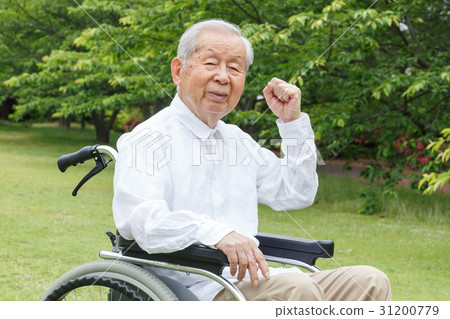 图库照片 年长 轮椅 握拳