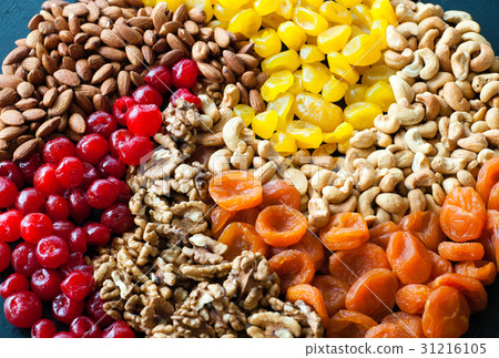 图库照片: dried fruits and nuts on black background