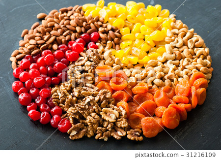 图库照片: dried fruits and nuts on black background