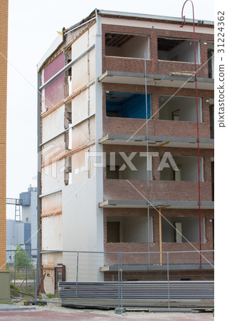 图库照片: demolishing a block of flats