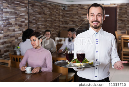 照片素材(图片): waiter welcoming guests in restaurant