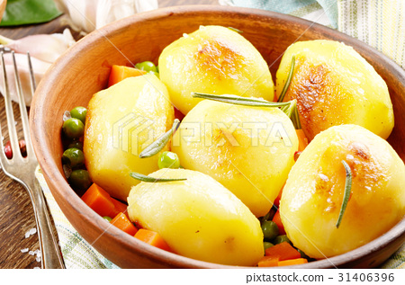 图库照片: boiled and baked potato and vegetables