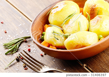 图库照片: boiled and baked potato and vegetables