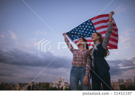 图库照片: american teens with flag travel