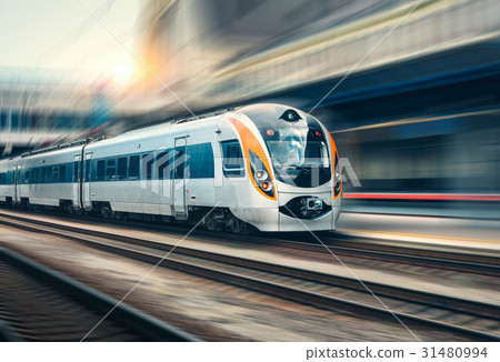 图库照片: high speed train in motion at the railway station