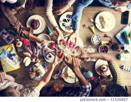 图库照片: people clinging drinks together on birthday party