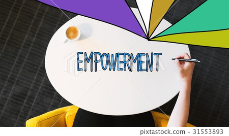 图库照片: empowerment text on a white table