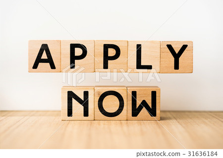 图库照片: floating wooden cube with " apply now " concept