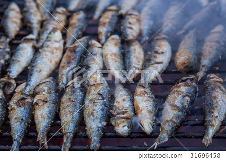 图库照片: sardines on grill on street bbq. portugal food