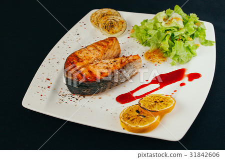 图库照片 salmon stake grilled with smoke salmon