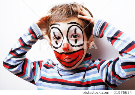 图库照片: little cute boy with facepaint like clown