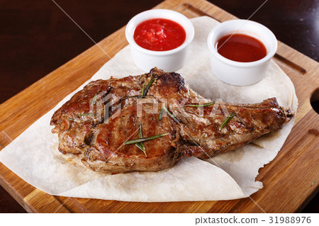 图库照片: ribeye steak with sauce