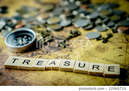 图库照片: treasure hunting concept with coins and compass