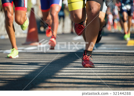 图库照片: marathon running race, people feet on city road