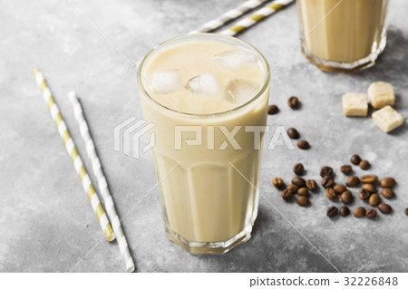 图库照片: ice coffee with milk in a tall glass