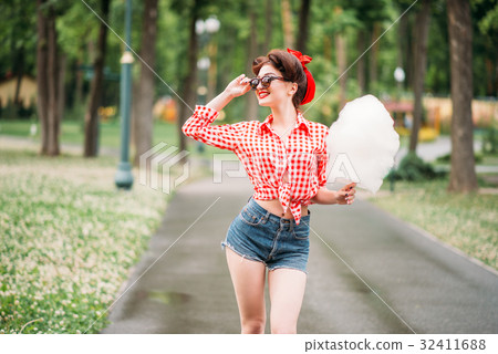 图库照片: glamour pin up girl with retro rotary telephones