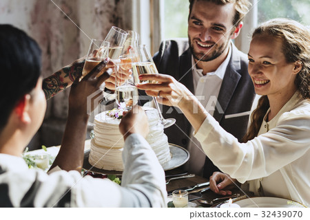 图库照片: people cling wine glasses on wedding reception with