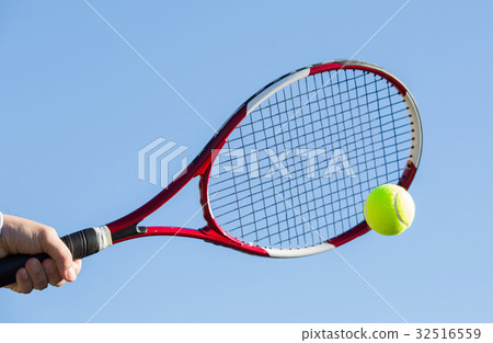 图库照片: tennis player hitting the ball