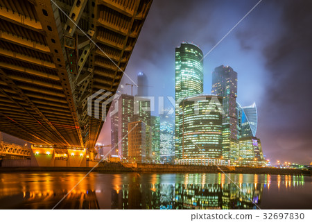 图库照片: moscow-city at night in the fog and at low clouds