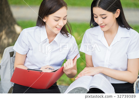 girlsand欧美,pacificgirls a portrait of two girls in uniform sitting on the bench and
