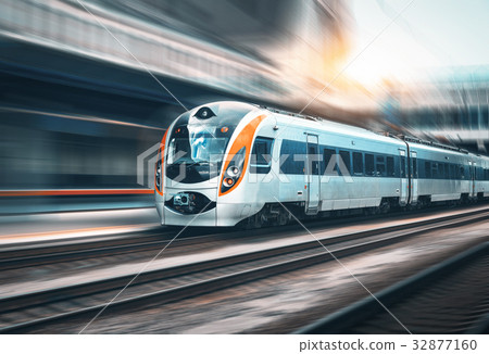 图库照片: high speed train in motion at the railway station