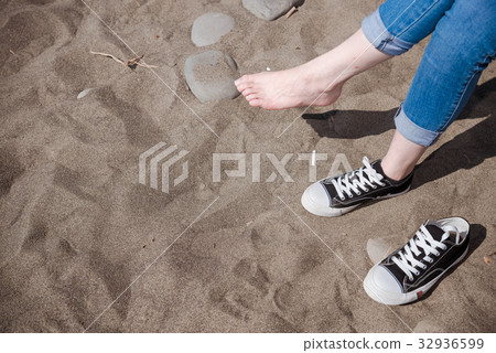 图库照片: clean beauty white foot lady sit on sandy beach