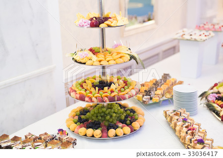 图库照片: various sweet sliced fruit on a buffet table