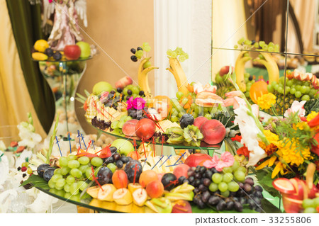图库照片: various sweet sliced fruit on a buffet table