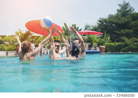 stock photo: friends having party in a swimming pool.