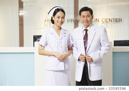 stock photo: a picture of a doctor and a nurse standing and