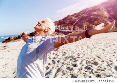 图库照片: young man in sport wear with outstretched arms