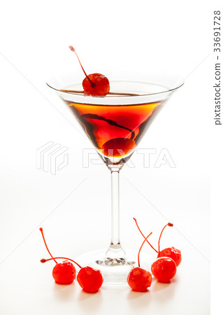 图库照片: manhattan cocktail garnished with a cherry